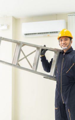 male-technician-repairing-air-conditioner-safety-uniform-indoors_61243-426